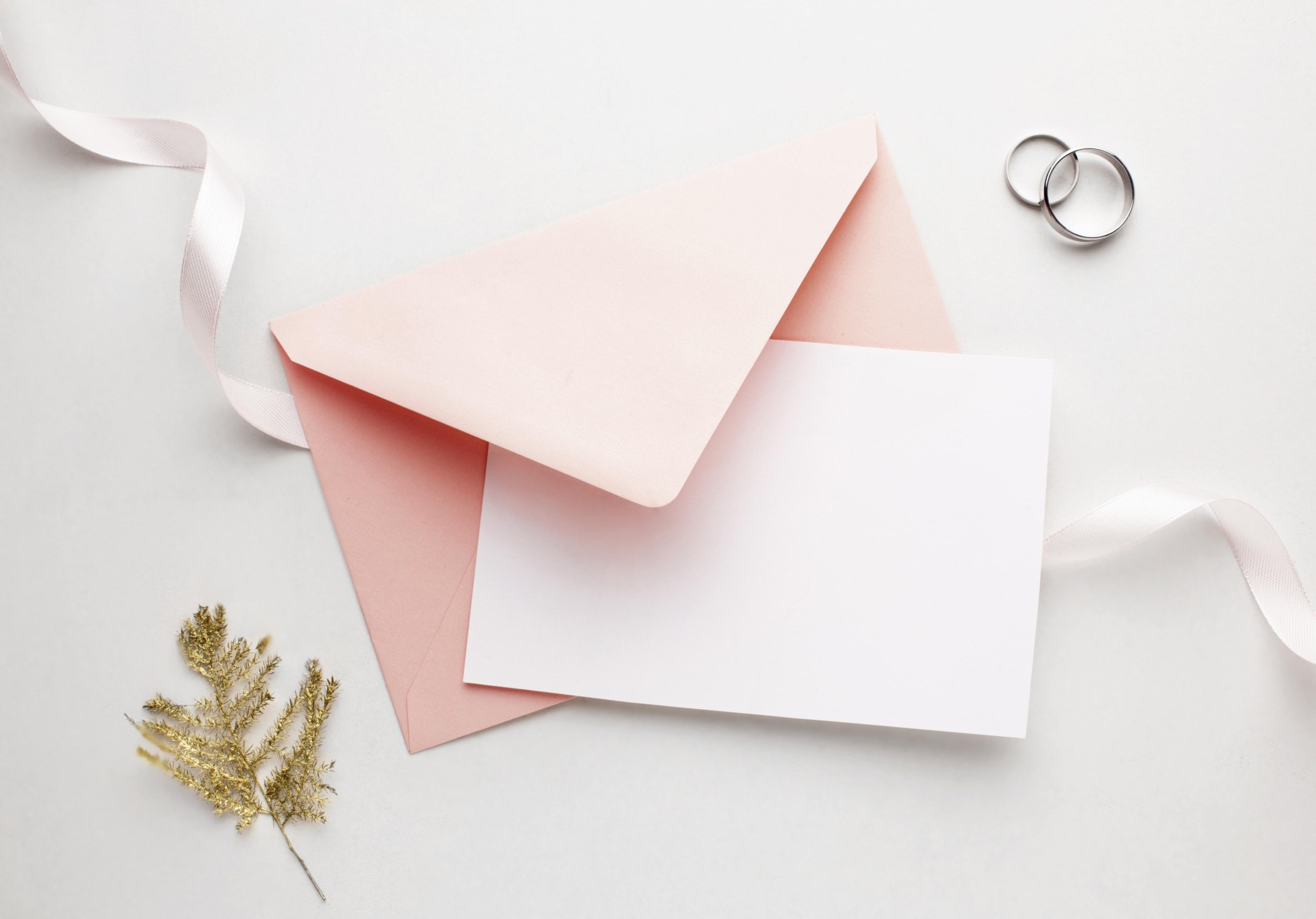 pink envelope and ribbon save the date wedding concept